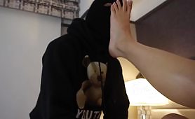Sneaky rubber get punished (or rewarded?) with a footjob and has to suck her toes
